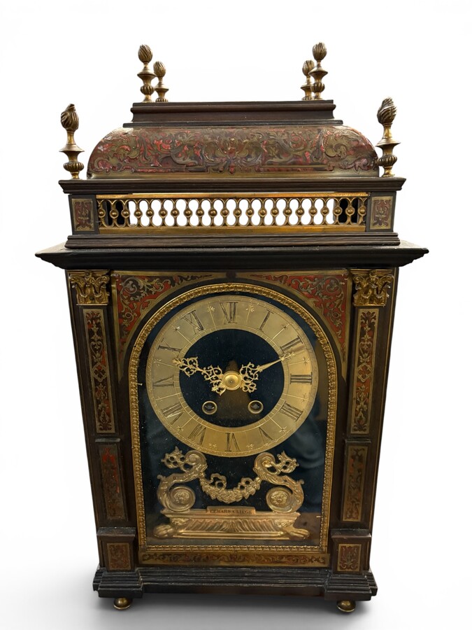 19th-century religious pendule in Boulle marquetry. Boulle marquetry cabinet by Gérard of Liège, from the Napoleonic period, in the Louis XIV Regency style. Beautiful cabinet design; the front features a door flanked by two Boulle pilasters 
