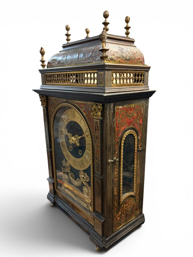19th-century religious pendule in Boulle marquetry. Boulle marquetry cabinet by Gérard of Liège, from the Napoleonic period, in the Louis XIV Regency style. Beautiful cabinet design; the front features a door flanked by two Boulle pilasters 