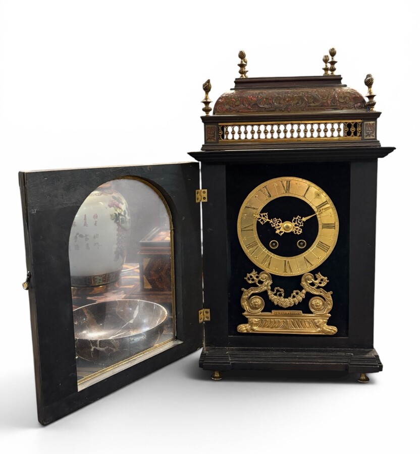 19th-century religious pendule in Boulle marquetry. Boulle marquetry cabinet by Gérard of Liège, from the Napoleonic period, in the Louis XIV Regency style. Beautiful cabinet design; the front features a door flanked by two Boulle pilasters 