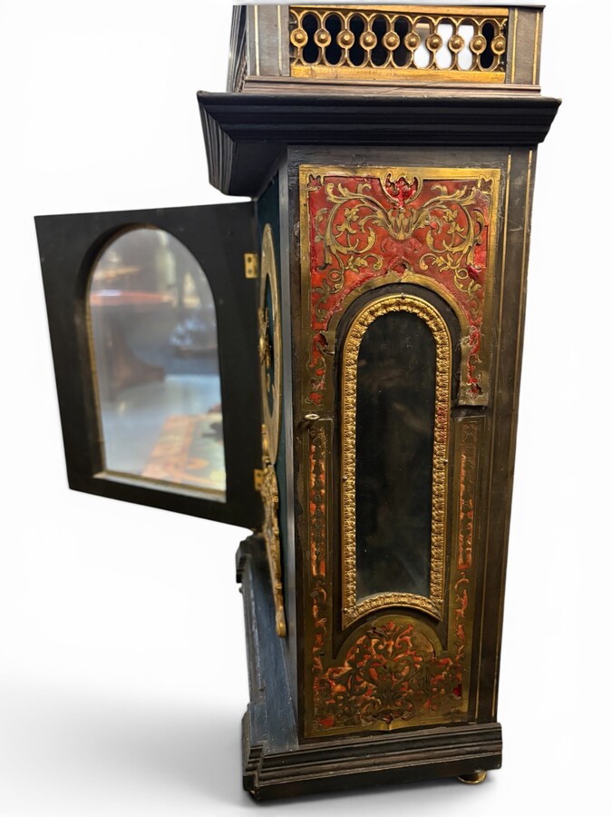19th-century religious pendule in Boulle marquetry. Boulle marquetry cabinet by Gérard of Liège, from the Napoleonic period, in the Louis XIV Regency style. Beautiful cabinet design; the front features a door flanked by two Boulle pilasters 