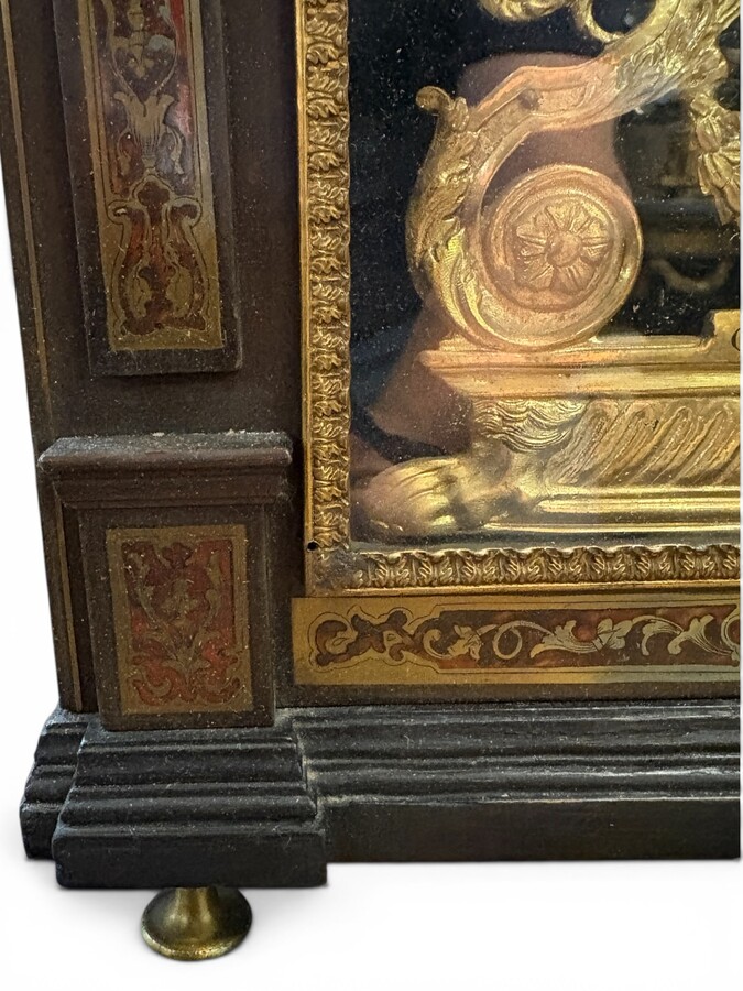 19th-century religious pendule in Boulle marquetry. Boulle marquetry cabinet by Gérard of Liège, from the Napoleonic period, in the Louis XIV Regency style. Beautiful cabinet design; the front features a door flanked by two Boulle pilasters 