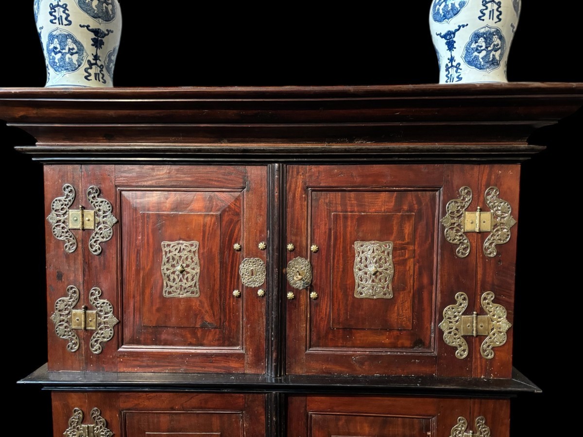 Colonial 4-door cabinet with 18th century bronze fittings Special piece of furniture from the Dutch Indies in tropical wood and ebony with 4 doors and beautiful bronze fittings. It stands on large carved feet. The cabinet can be dismantled.