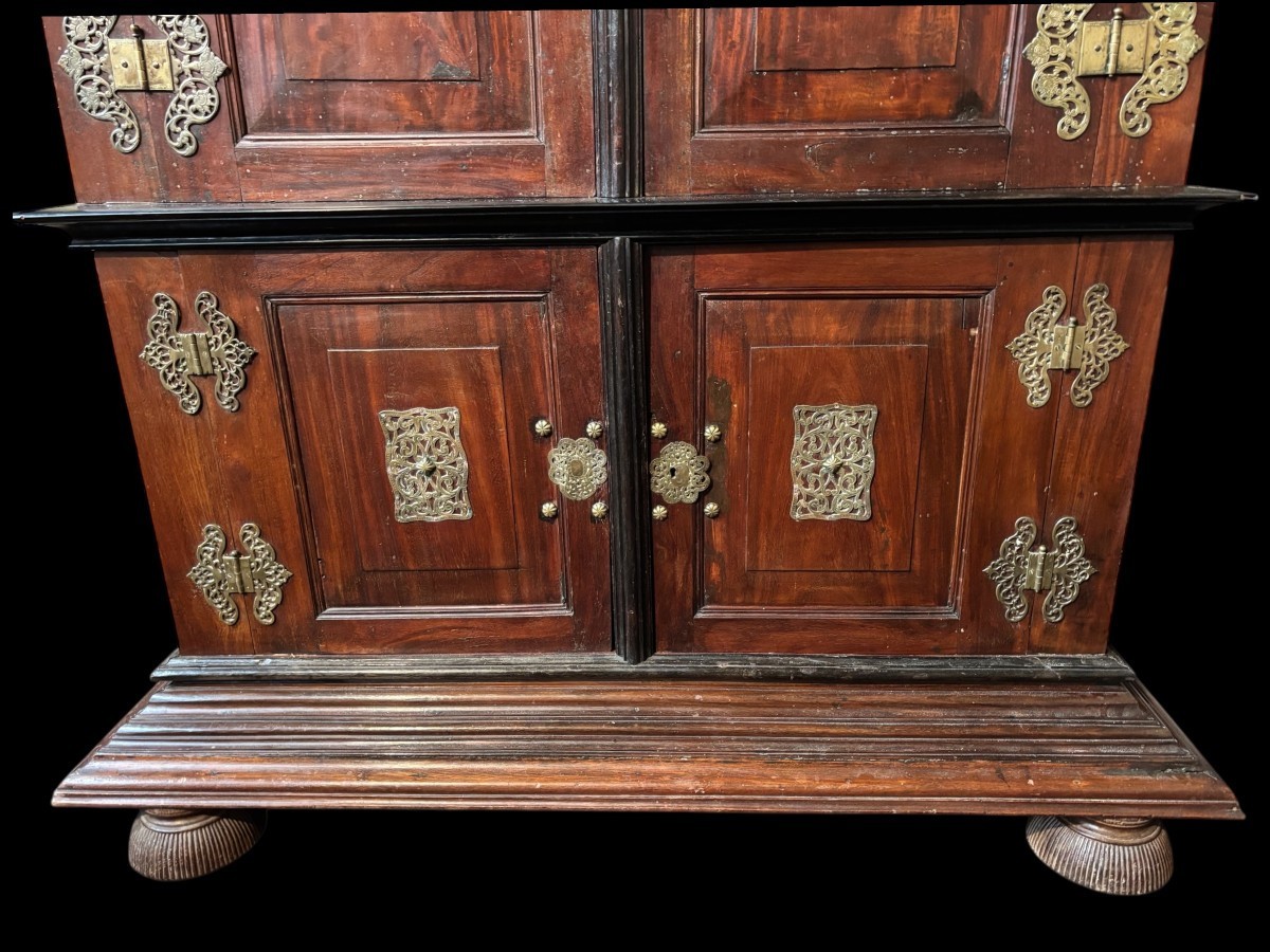 Colonial 4-door cabinet with 18th century bronze fittings Special piece of furniture from the Dutch Indies in tropical wood and ebony with 4 doors and beautiful bronze fittings. It stands on large carved feet. The cabinet can be dismantled.