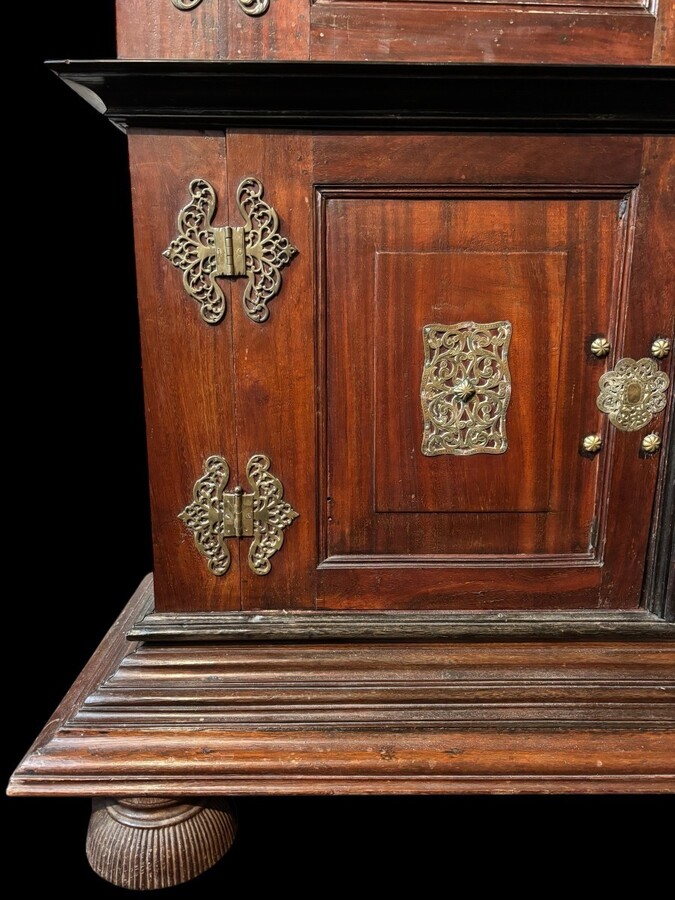 Colonial 4-door cabinet with 18th century bronze fittings Special piece of furniture from the Dutch Indies in tropical wood and ebony with 4 doors and beautiful bronze fittings. It stands on large carved feet. The cabinet can be dismantled.