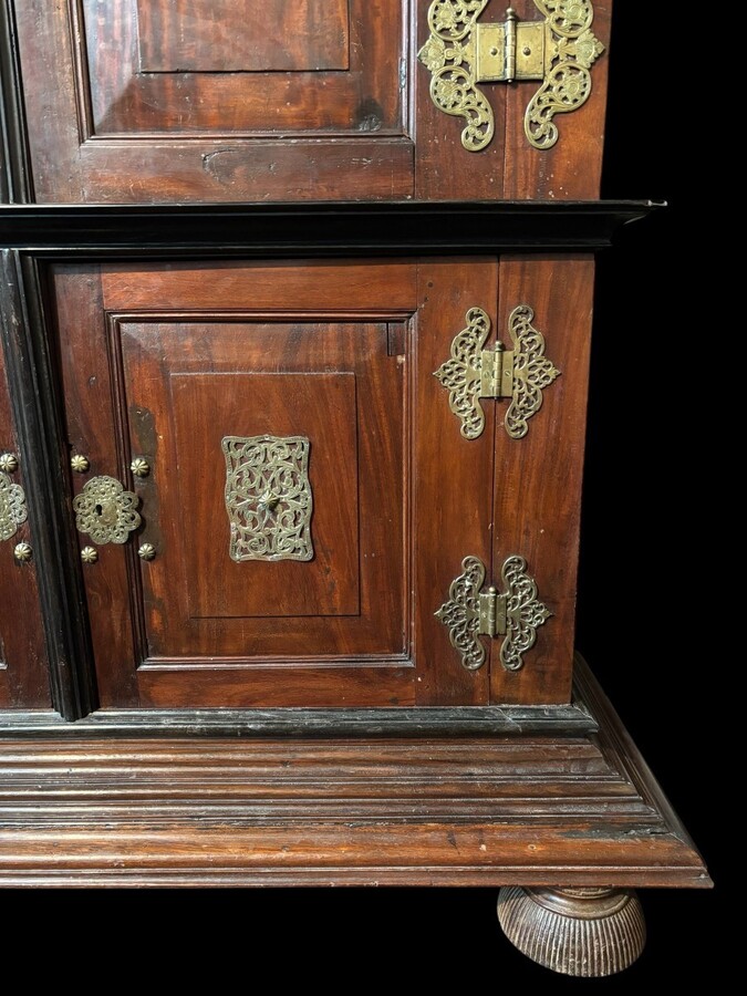 Colonial 4-door cabinet with 18th century bronze fittings Special piece of furniture from the Dutch Indies in tropical wood and ebony with 4 doors and beautiful bronze fittings. It stands on large carved feet. The cabinet can be dismantled.