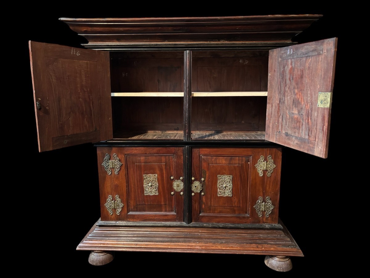 Colonial 4-door cabinet with 18th century bronze fittings Special piece of furniture from the Dutch Indies in tropical wood and ebony with 4 doors and beautiful bronze fittings. It stands on large carved feet. The cabinet can be dismantled.