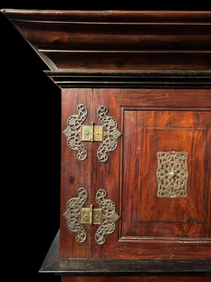 Colonial 4-door cabinet with 18th century bronze fittings Special piece of furniture from the Dutch Indies in tropical wood and ebony with 4 doors and beautiful bronze fittings. It stands on large carved feet. The cabinet can be dismantled.