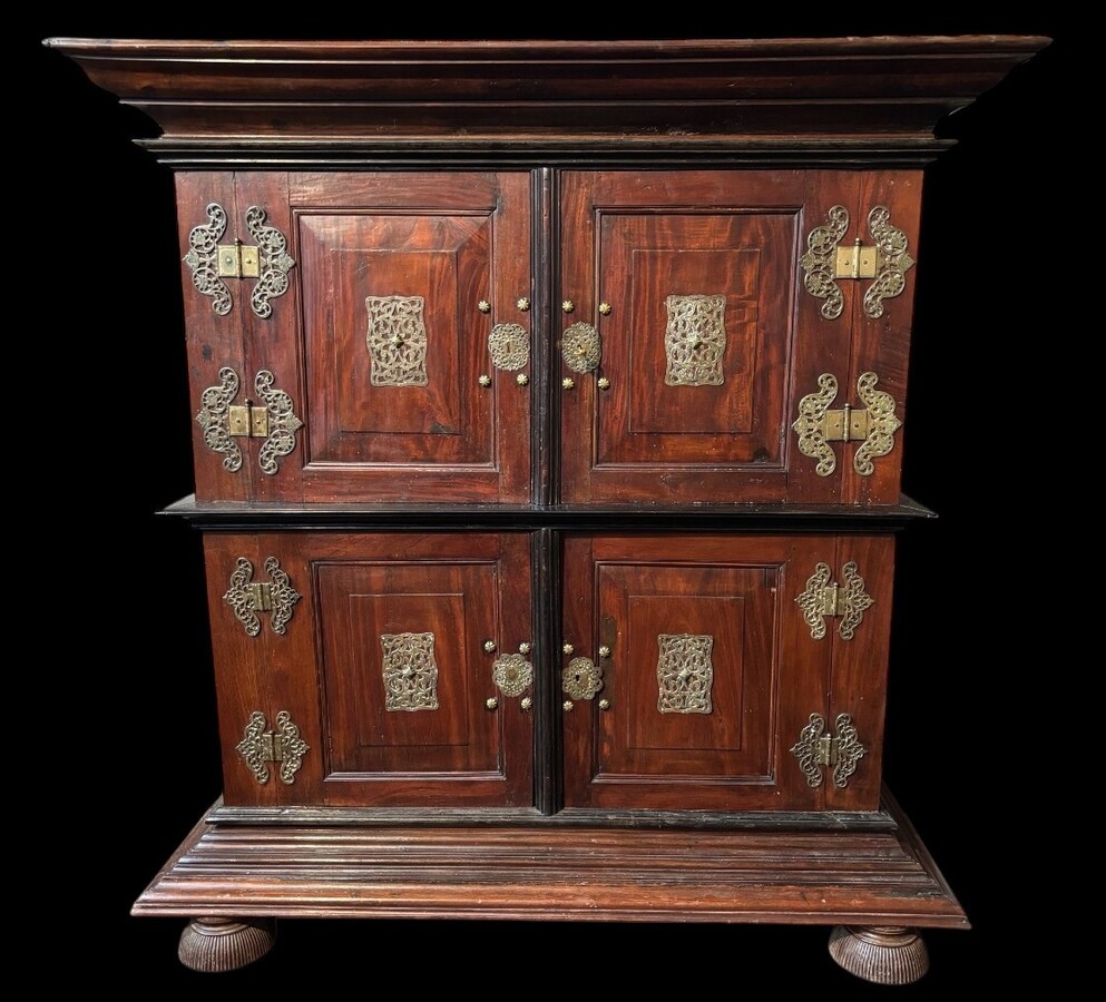 Colonial 4-door cabinet with 18th century bronze fittings Special piece of furniture from the Dutch Indies in tropical wood and ebony with 4 doors and beautiful bronze fittings. It stands on large carved feet. The cabinet can be dismantled.