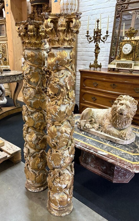 Pair of 17thC. Baroque twisted columns. Decorative columns adorned with vines, birds and Corinthian capitals covered with antique gilding and polychrome decoration.Columns in good condition with wear to the wood, gilding and polychrome.