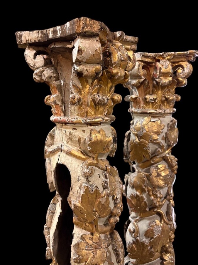 Pair of 17thC. Baroque twisted columns. Decorative columns adorned with vines, birds and Corinthian capitals covered with antique gilding and polychrome decoration.Columns in good condition with wear to the wood, gilding and polychrome.
