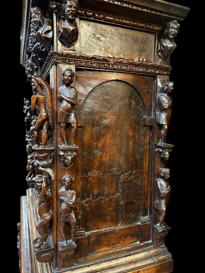 16th-century Italian Renaissance walnut cabinet Magnificent two-part cabinet with numerous doors and drawers, adorned with superb carvings and decorations. The upper section rests on its original base. Exceptional cabinet
