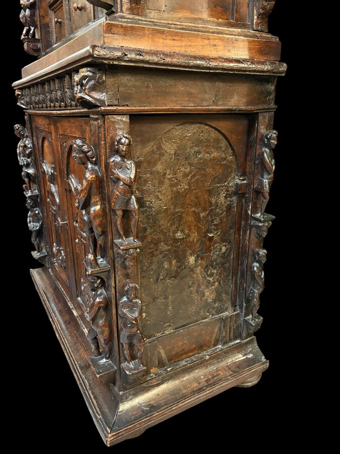 16th-century Italian Renaissance walnut cabinet Magnificent two-part cabinet with numerous doors and drawers, adorned with superb carvings and decorations. The upper section rests on its original base. Exceptional cabinet