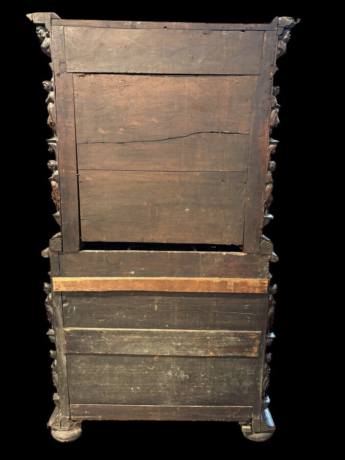 16th-century Italian Renaissance walnut cabinet Magnificent two-part cabinet with numerous doors and drawers, adorned with superb carvings and decorations. The upper section rests on its original base. Exceptional cabinet