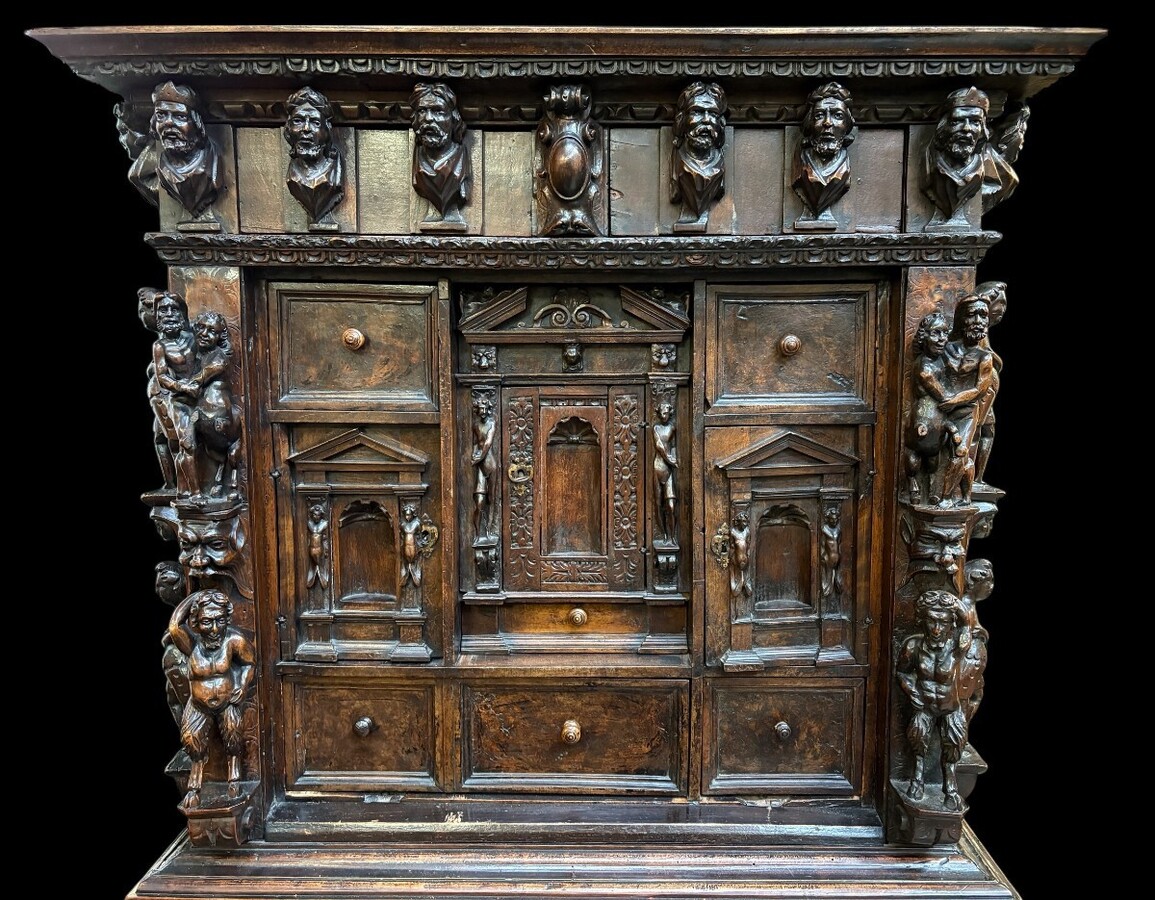 16th-century Italian Renaissance walnut cabinet Magnificent two-part cabinet with numerous doors and drawers, adorned with superb carvings and decorations. The upper section rests on its original base. Exceptional cabinet