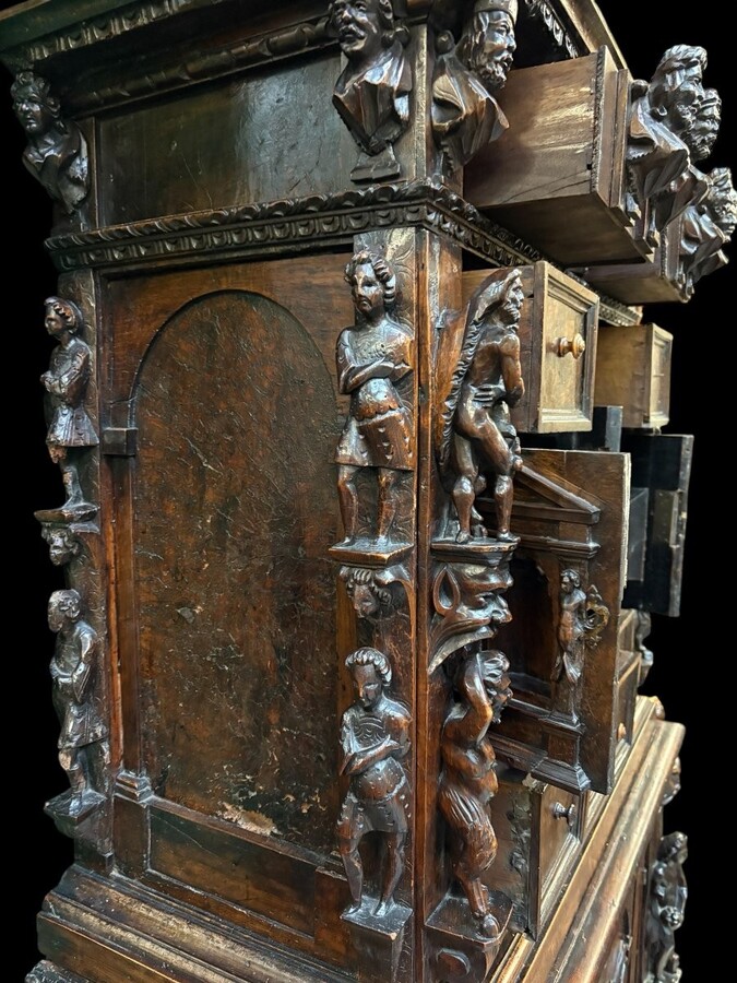 16th-century Italian Renaissance walnut cabinet Magnificent two-part cabinet with numerous doors and drawers, adorned with superb carvings and decorations. The upper section rests on its original base. Exceptional cabinet