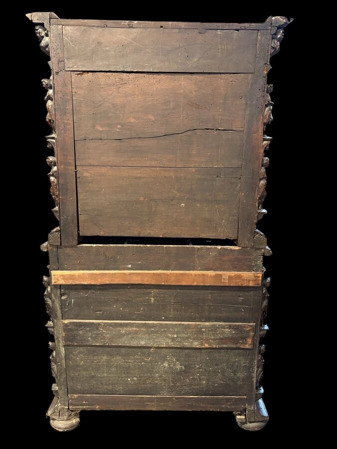 16th-century Italian Renaissance walnut cabinet Magnificent two-part cabinet with numerous doors and drawers, adorned with superb carvings and decorations. The upper section rests on its original base. Exceptional cabinet