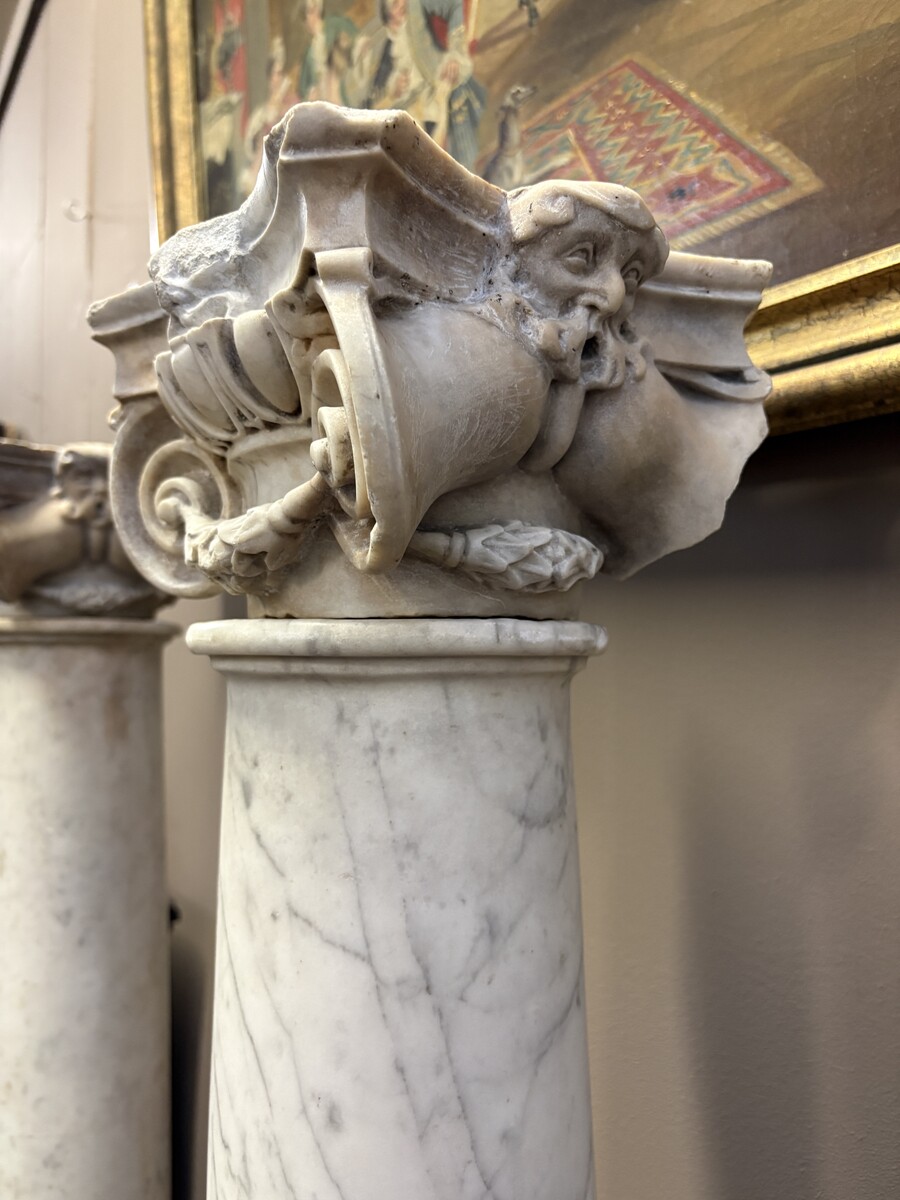 17th-century Renaissance marble fireplace. Beautiful columns from a Renaissance-era fireplace, in the Flemish style, dating from around 1600. Two white marble columns with Corinthian capitals, adorned with mythological figures
