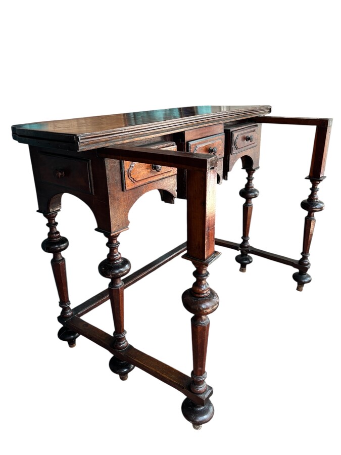 17th century walnut folding table. Elegant Louis XIV walnut and oak folding/writing table with folding system, 3 small drawers and folding top. Beautiful table in used condition with some minor defects. 