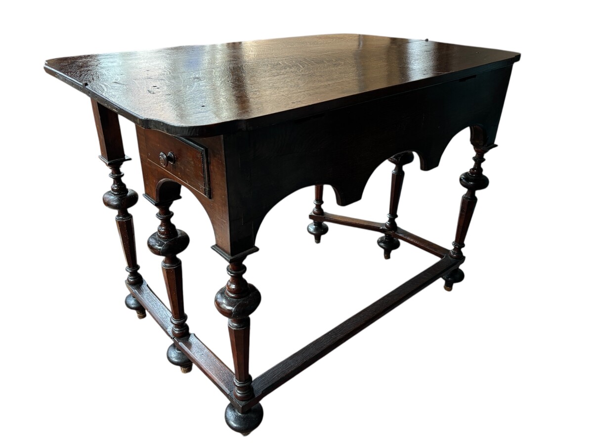 17th century walnut folding table. Elegant Louis XIV walnut and oak folding/writing table with folding system, 3 small drawers and folding top. Beautiful table in used condition with some minor defects. 