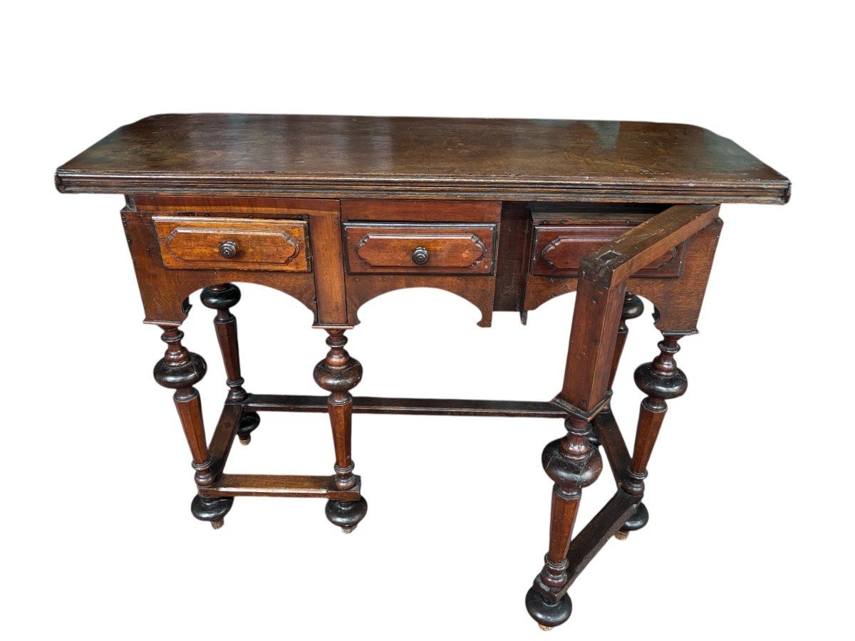 17th century walnut folding table. Elegant Louis XIV walnut and oak folding/writing table with folding system, 3 small drawers and folding top. Beautiful table in used condition with some minor defects.
