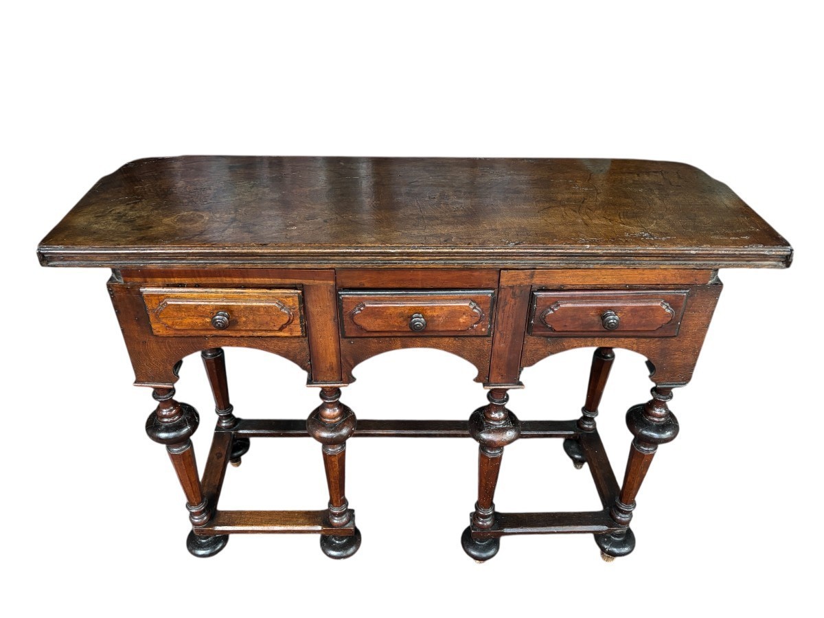 17th century walnut folding table. Elegant Louis XIV walnut and oak folding/writing table with folding system, 3 small drawers and folding top. Beautiful table in used condition with some minor defects.