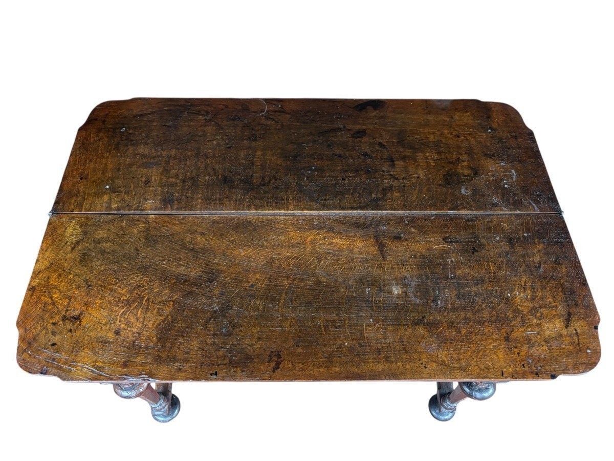 17th century walnut folding table. Elegant Louis XIV walnut and oak folding/writing table with folding system, 3 small drawers and folding top. Beautiful table in used condition with some minor defects.
