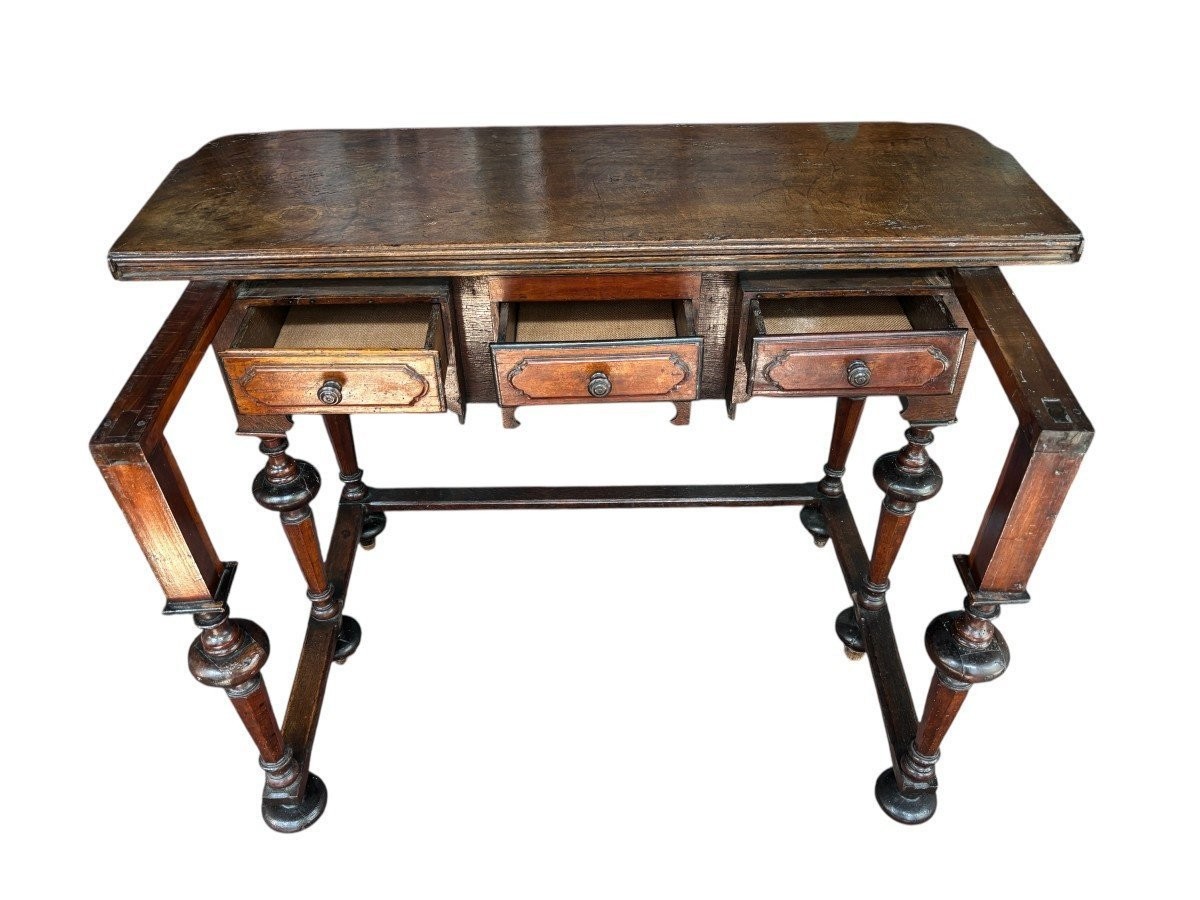 17th century walnut folding table. Elegant Louis XIV walnut and oak folding/writing table with folding system, 3 small drawers and folding top. Beautiful table in used condition with some minor defects.