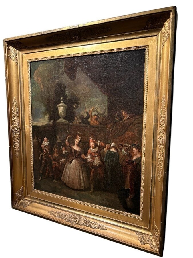 18th century painting ‘Dance scene with Harlequin’ oil on canvas. Decorative painting depicting a dance scene of nobles with a harlequin in a city garden in a beautiful gilt Empire frame.