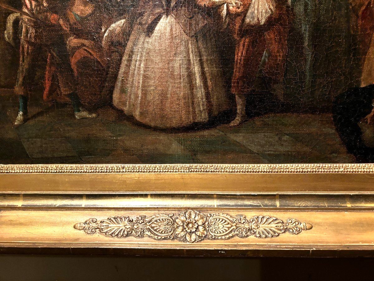 18th century painting ‘Dance scene with Harlequin’ oil on canvas. Decorative painting depicting a dance scene of nobles with a harlequin in a city garden in a beautiful gilt Empire frame.
