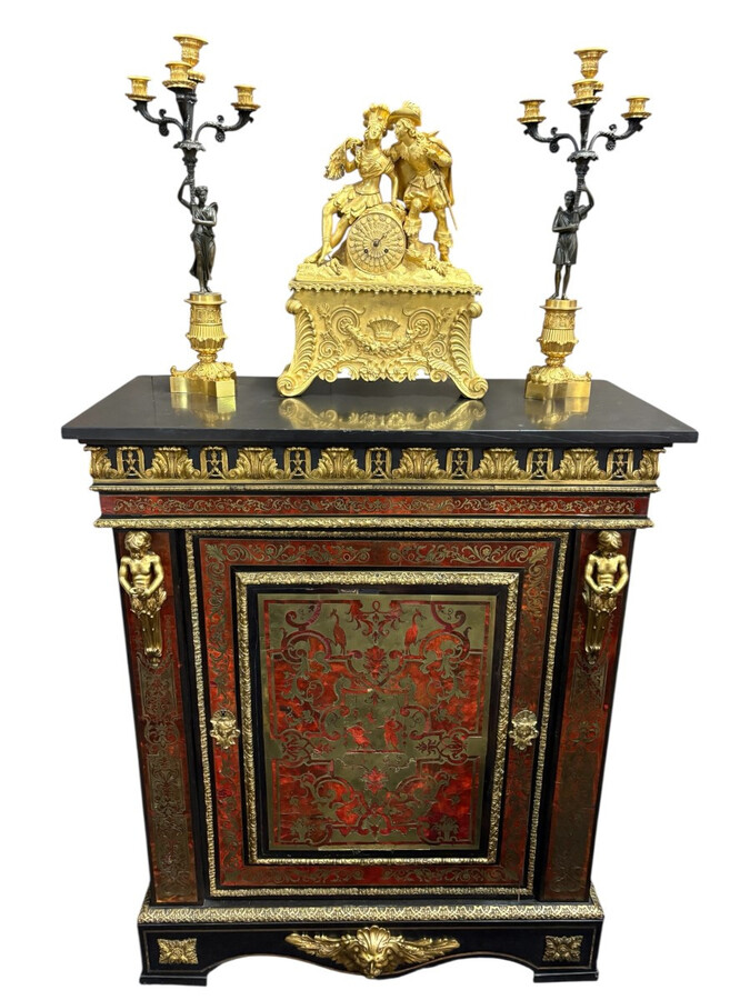 19th century Boulle marquetry sideboard in blackened pear wood inlaid with copper filigree, red tortoiseshell and copper veneer. (restoration required). Chiselled and gilded bronze decorations with acanthus leaves, clasps and rosettes. Black marble top.
