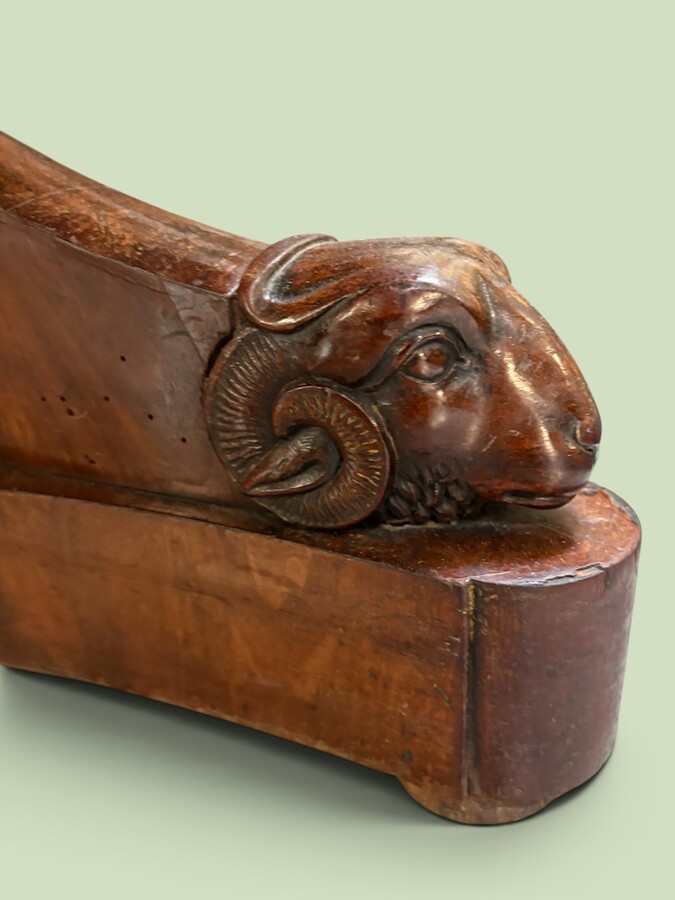  19th-century Charles X-style mahogany pedestal table. Table, featuring three elegant curved legs adorned with ram’s heads. The top is edged with a solid mahogany rim. In good condition, with slight signs of we
