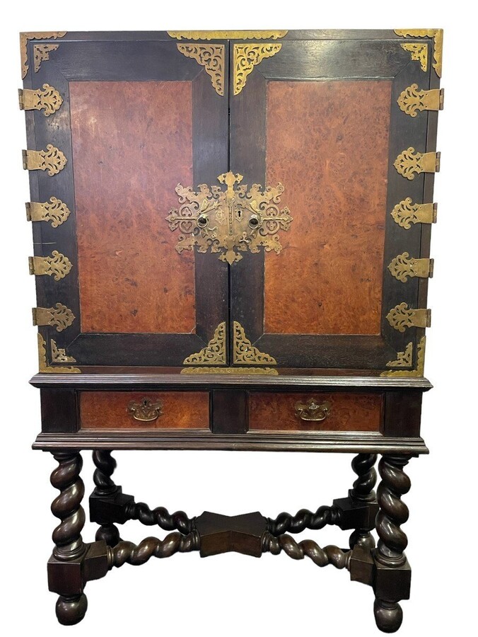 19th century colonial cabinet in ebony and burnt wood. Beautiful piece of furniture in 2 parts decorated with numerous bronze fittings and behind the 2 doors equipped with 9 drawers and 2 in the base. Dimensions : Height: 158 cm Width : 104 cm Depth : 46