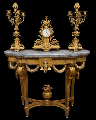 19th-century Louis XVI-style console table in gilded wood. The console features four legs decorated with garlands and a large vase at the base, topped with a superb 3 cm thick grey marble top. The console and marble top are in good condition