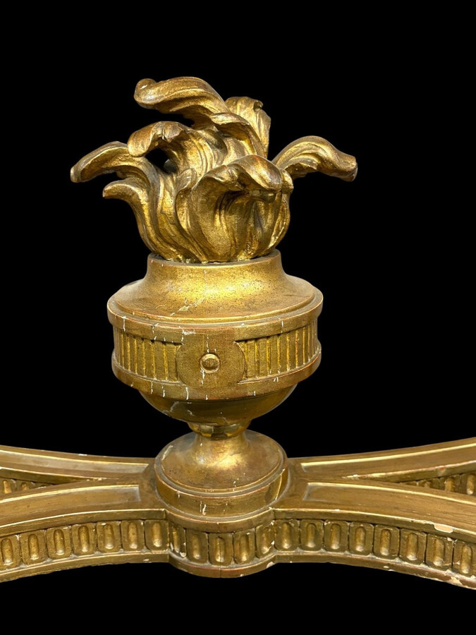 19th-century Louis XVI-style console table in gilded wood. The console features four legs decorated with garlands and a large vase at the base, topped with a superb 3 cm thick grey marble top. The console and marble top are in good condition