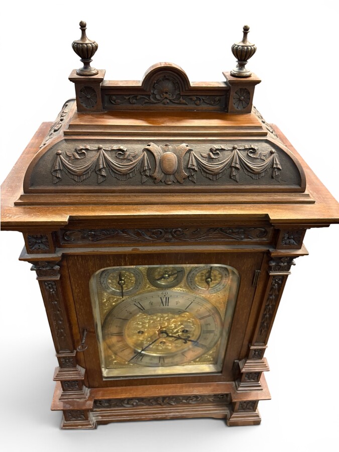 ‘8-bell’ Bracket Clock, Glasgow, 19thC. A very fine bracket clock with exquisitely carved details and a richly decorated bronze dial. The dial is signed C. Edward & Sons, Glasgow. The mechanism is fitted with 8 bells and 5 gongs. 