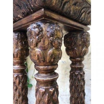 A gilded wooden pedestal with four columns 18th Century. Renaissance style with angel heads. In very good condition with following dimensions : Height : 127 cm Width above : 27 x 27 cm Foot : 38.5 x 39 cm
