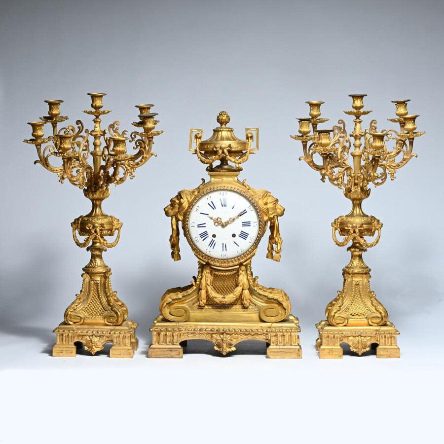 A Large Gilt Bronze LXVI Style Mantelpiece Paris, 19th Century. The Clock And The Candelabras Are Gilded With Matt And Bright Gold. Clock Signed By G.Philippe, Palais Royal 66 & 67 In Paris. Dimensions Clock: 68 Cm High, 42 Cm Wide And 24 Cm Deep.
