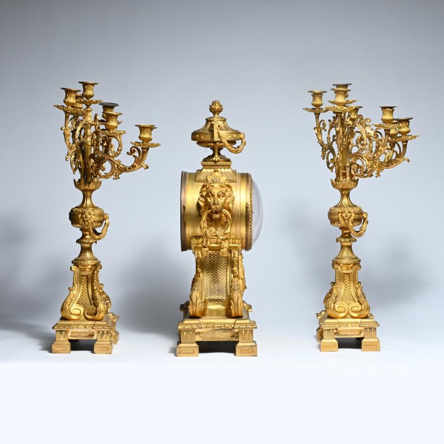 A Large Gilt Bronze LXVI Style Mantelpiece Paris, 19th Century. The Clock And The Candelabras Are Gilded With Matt And Bright Gold. Clock Signed By G.Philippe, Palais Royal 66 & 67 In Paris. Dimensions Clock: 68 Cm High, 42 Cm Wide And 24 Cm Deep.