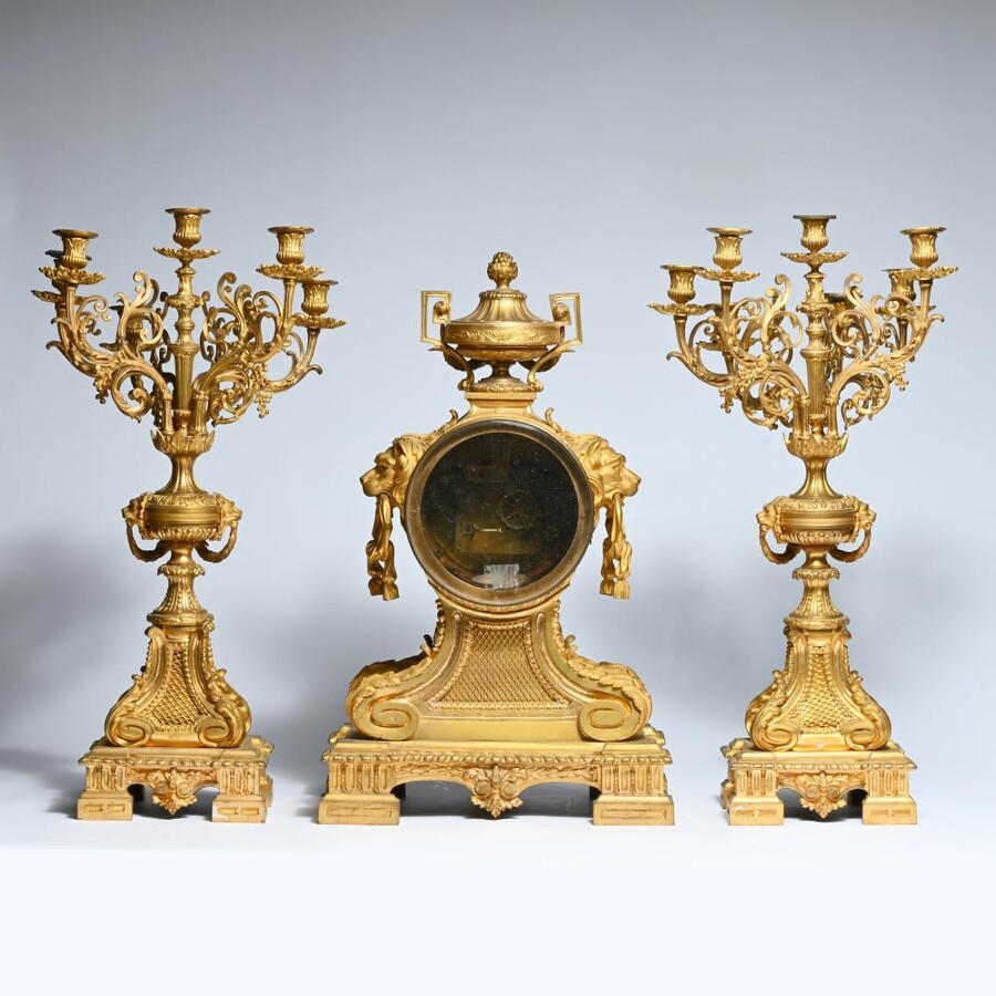 A Large Gilt Bronze LXVI Style Mantelpiece Paris, 19th Century. The Clock And The Candelabras Are Gilded With Matt And Bright Gold. Clock Signed By G.Philippe, Palais Royal 66 & 67 In Paris. Dimensions Clock: 68 Cm High, 42 Cm Wide And 24 Cm Deep.