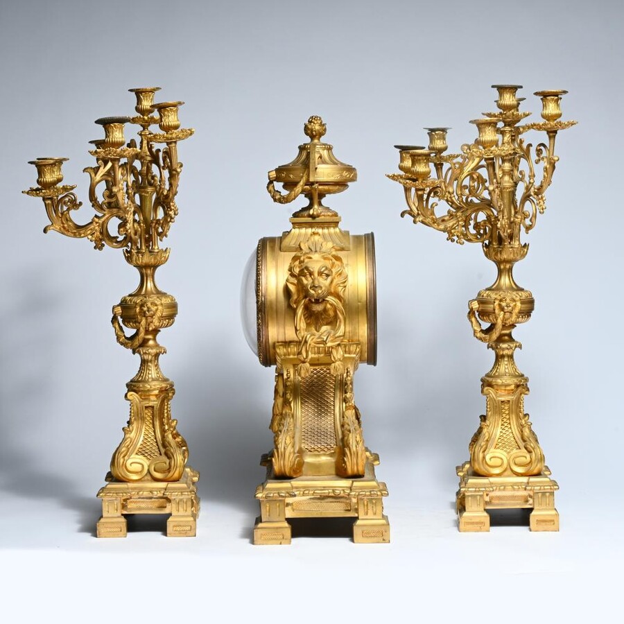 A Large Gilt Bronze LXVI Style Mantelpiece Paris, 19th Century. The Clock And The Candelabras Are Gilded With Matt And Bright Gold. Clock Signed By G.Philippe, Palais Royal 66 & 67 In Paris. Dimensions Clock: 68 Cm High, 42 Cm Wide And 24 Cm Deep.