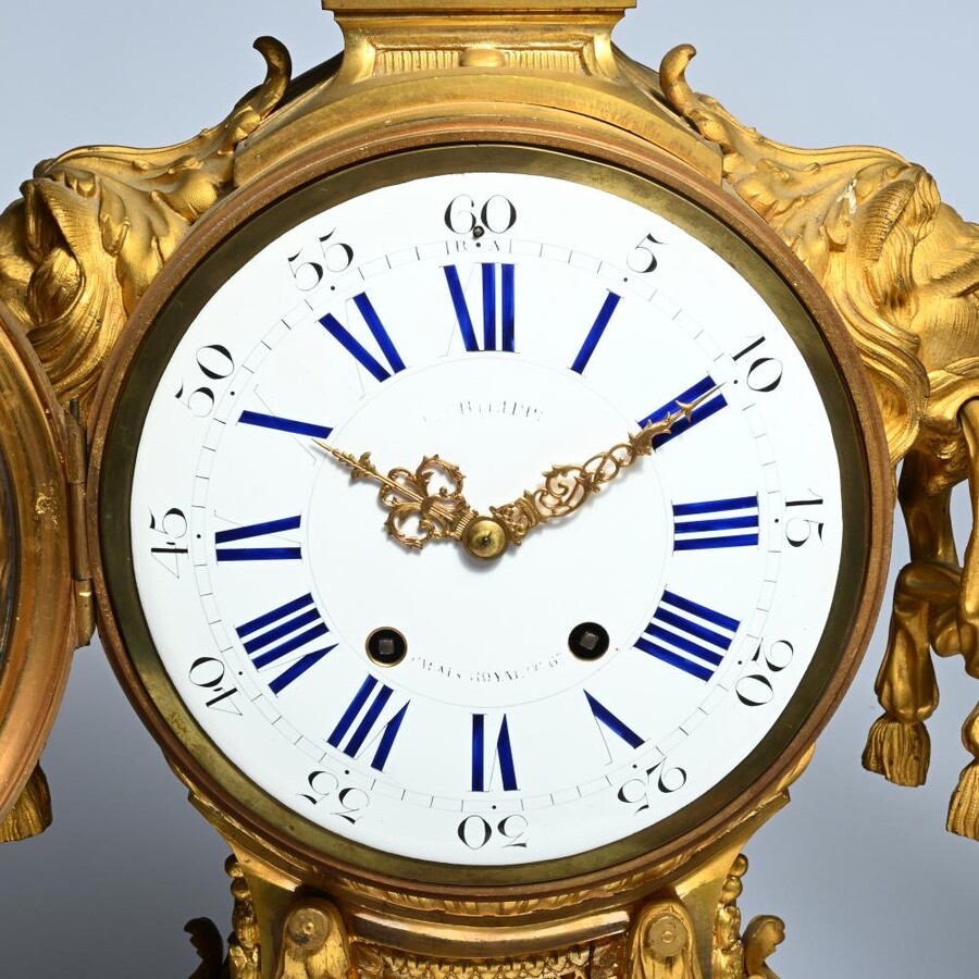 A Large Gilt Bronze LXVI Style Mantelpiece Paris, 19th Century. The Clock And The Candelabras Are Gilded With Matt And Bright Gold. Clock Signed By G.Philippe, Palais Royal 66 & 67 In Paris. Dimensions Clock: 68 Cm High, 42 Cm Wide And 24 Cm Deep.