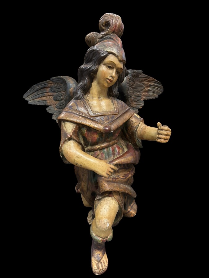 A lovely 18th-century polychrome wooden angel A decorative angel carved from wood and beautifully painted The angel is in good condition, with minor damage to the lower part of one wing. Dimensions: Height: 68 cm Width: 54 cm