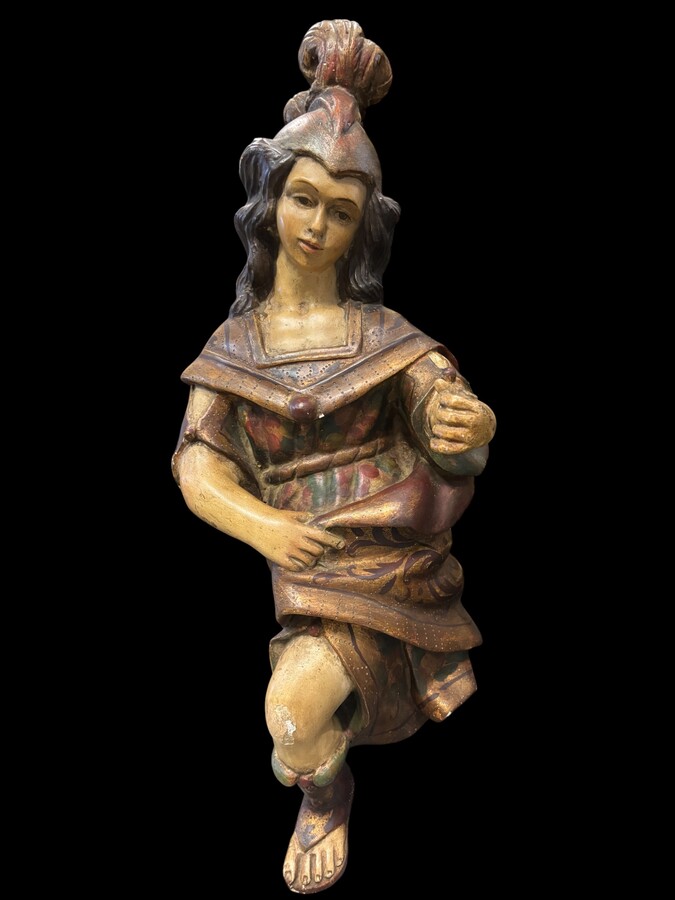 A lovely 18th-century polychrome wooden angel A decorative angel carved from wood and beautifully painted The angel is in good condition, with minor damage to the lower part of one wing. Dimensions: Height: 68 cm Width: 54 cm