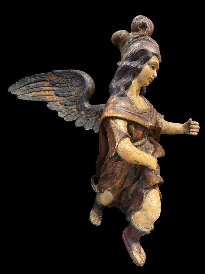A lovely 18th-century polychrome wooden angel A decorative angel carved from wood and beautifully painted The angel is in good condition, with minor damage to the lower part of one wing. Dimensions: Height: 68 cm Width: 54 cm