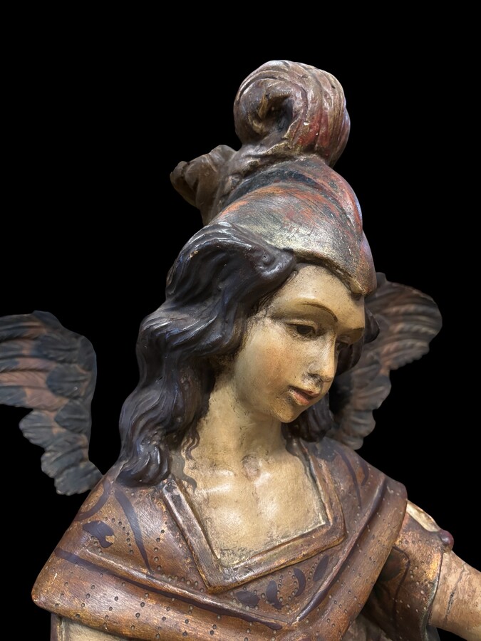 A lovely 18th-century polychrome wooden angel A decorative angel carved from wood and beautifully painted The angel is in good condition, with minor damage to the lower part of one wing. Dimensions: Height: 68 cm Width: 54 cm