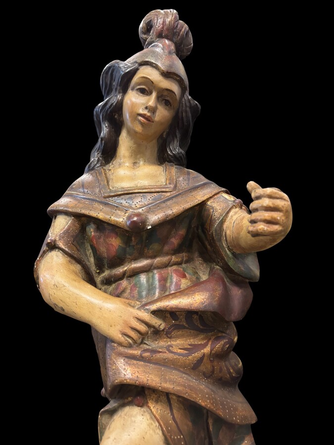 A lovely 18th-century polychrome wooden angel A decorative angel carved from wood and beautifully painted The angel is in good condition, with minor damage to the lower part of one wing. Dimensions: Height: 68 cm Width: 54 cm