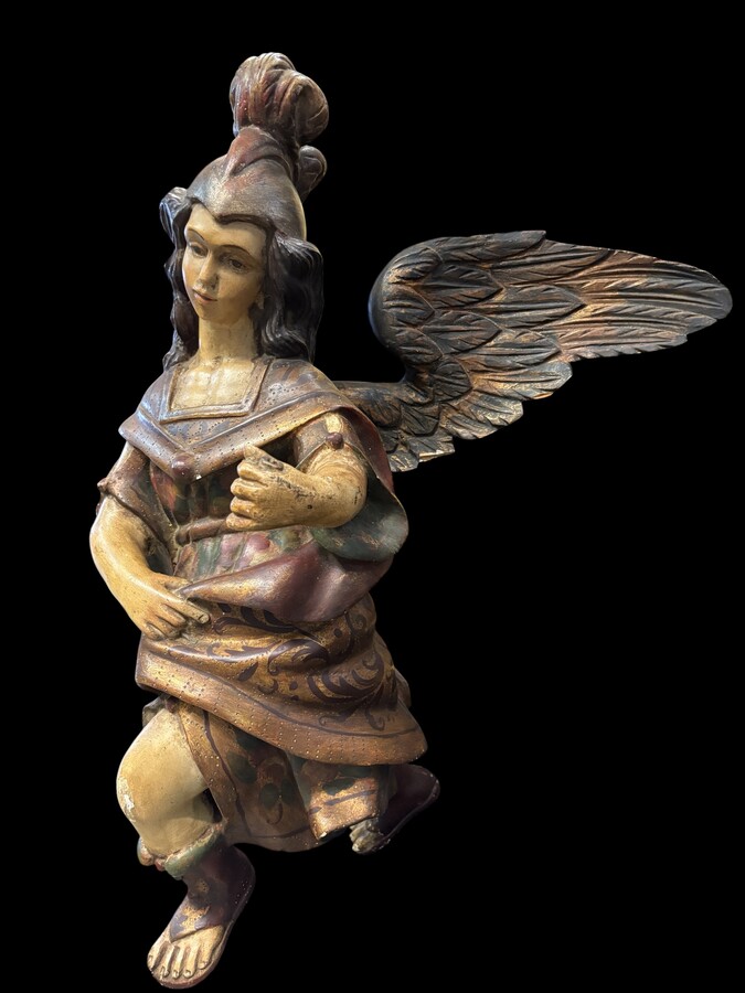 A lovely 18th-century polychrome wooden angel A decorative angel carved from wood and beautifully painted The angel is in good condition, with minor damage to the lower part of one wing. Dimensions: Height: 68 cm Width: 54 cm