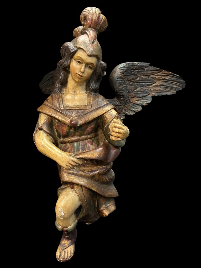 A lovely 18th-century polychrome wooden angel A decorative angel carved from wood and beautifully painted The angel is in good condition, with minor damage to the lower part of one wing. Dimensions: Height: 68 cm Width: 54 cm