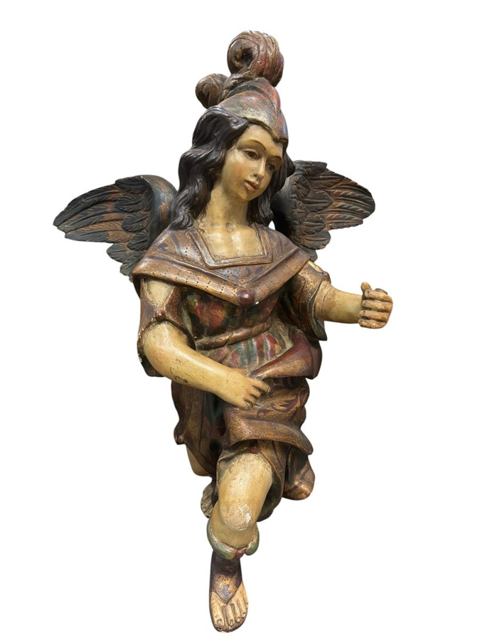 A lovely 18th-century polychrome wooden angel A decorative angel carved from wood and beautifully painted The angel is in good condition, with minor damage to the lower part of one wing. Dimensions: Height: 68 cm Width: 54 cm