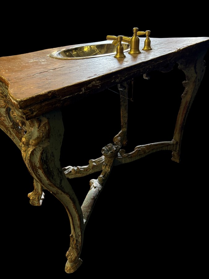 A nice 18thC. console table with a marble-effect wooden top, recently fitted with a metal washbasin and bronze taps (which have never been connected...) The console table is in good condition, showing slight signs of wear and some old paintwork. 